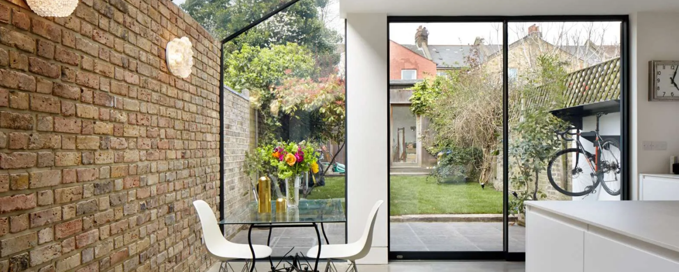 Contemporary glass rear extension with an open-plan interior